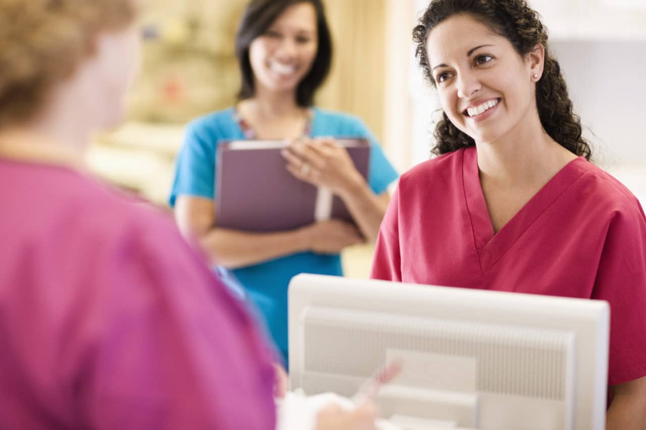 Photo of a staff member greeting a patient