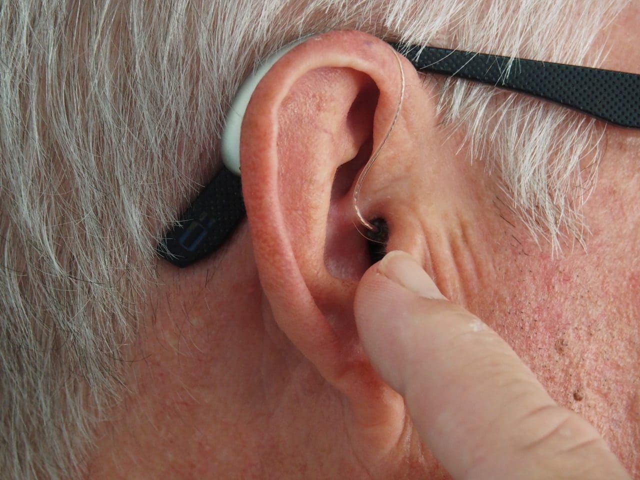 Close-up of a man's hearing aid