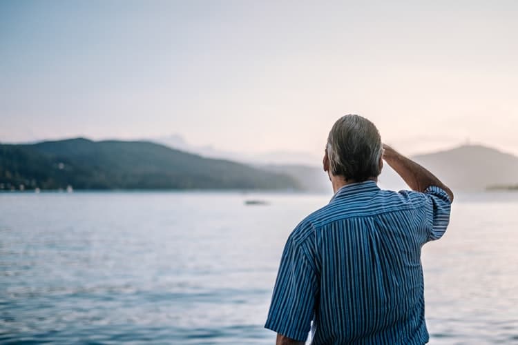 Man looks out at waterfront