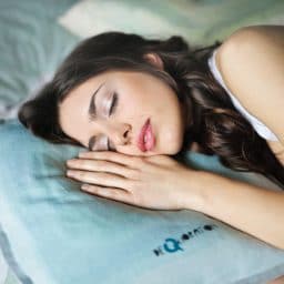 Woman sleeping on pillow.
