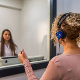 Young woman receiving a hearing test.
