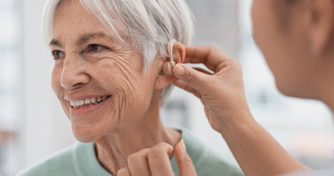 Woman gets hearing aid fitted