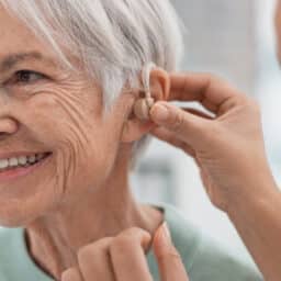 Woman gets hearing aid fitted