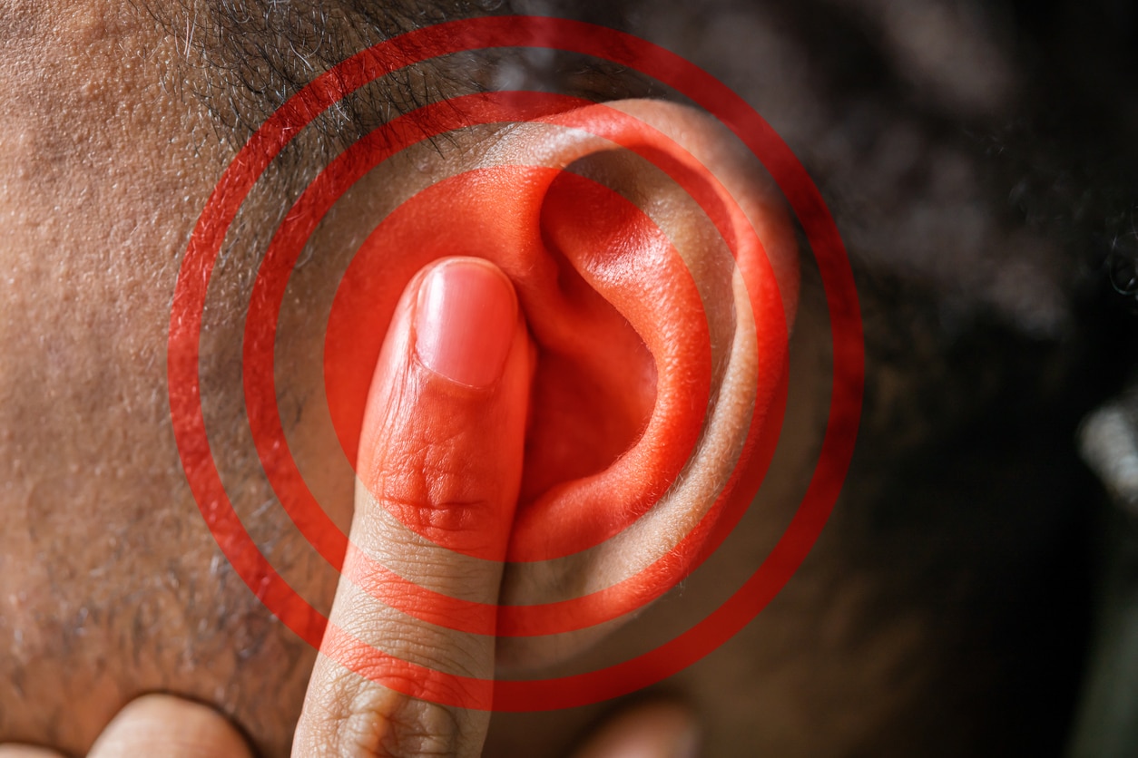 Red Circle On Man's Ear, Tinnitus Concept. 